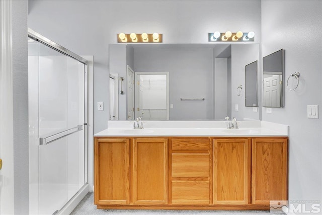 2140 Avella Dr, Sparks, NV 89434 - full bathroom featuring a stall shower, double vanity, and a walk in closet