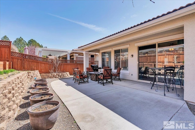 2140 Avella Dr, Sparks, NV 89434 - view of patio featuring outdoor dining space and a fenced backyard