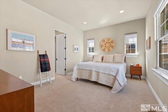 20605 Parc Foret Dr, Reno, NV 89511 - bedroom featuring multiple windows, light colored carpet, recessed lighting, and baseboards