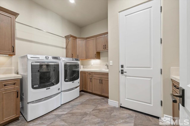 20605 Parc Foret Dr, Reno, NV 89511 - laundry area featuring washer and dryer, cabinet space, and baseboards