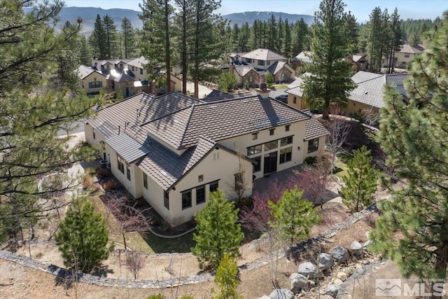 20605 Parc Foret Dr, Reno, NV 89511 - aerial view of residential area featuring a mountainous background and a heavily wooded area