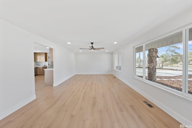 1309 Raeline Ln, Minden, NV 89423 - unfurnished living room featuring ceiling fan, light wood-style flooring, baseboards, and recessed lighting