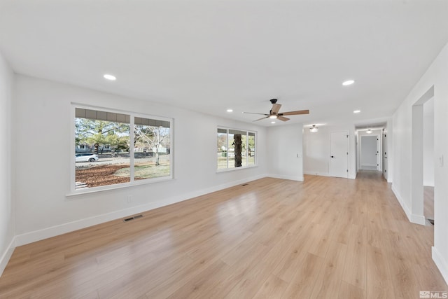 1309 Raeline Ln, Minden, NV 89423 - unfurnished living room featuring recessed lighting, healthy amount of natural light, a ceiling fan, light wood-style floors, and baseboards