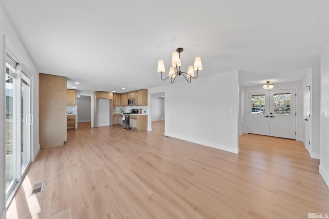 1309 Raeline Ln, Minden, NV 89423 - unfurnished living room with a chandelier, light wood-style floors, baseboards, french doors, and recessed lighting