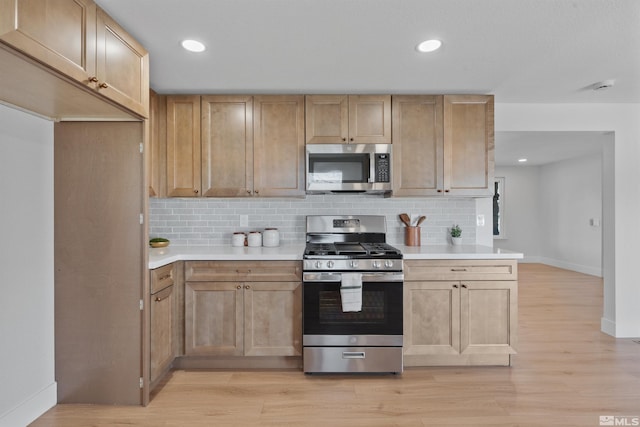 1309 Raeline Ln, Minden, NV 89423 - kitchen with appliances with stainless steel finishes, baseboards, backsplash, and recessed lighting
