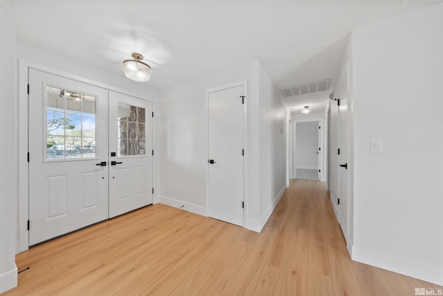 1309 Raeline Ln, Minden, NV 89423 - entrance foyer with light wood-type flooring, french doors, and baseboards