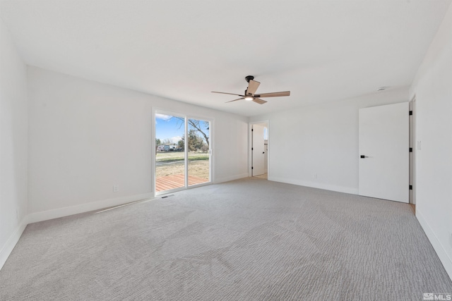 1309 Raeline Ln, Minden, NV 89423 - spare room featuring a ceiling fan, light colored carpet, and baseboards