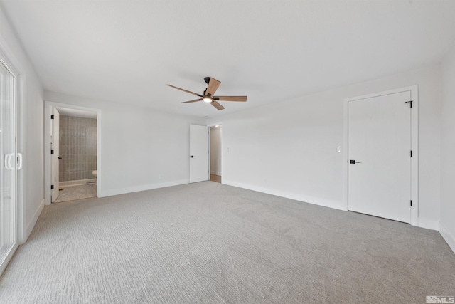 1309 Raeline Ln, Minden, NV 89423 - unfurnished bedroom with light colored carpet, baseboards, ceiling fan, and ensuite bathroom