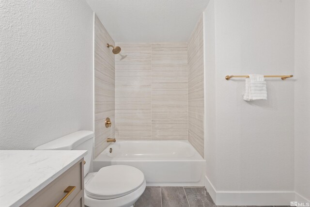 1309 Raeline Ln, Minden, NV 89423 - full bathroom featuring toilet, vanity, a textured wall, shower / washtub combination, and wood finished floors
