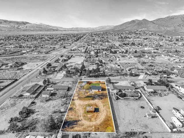1309 Raeline Ln, Minden, NV 89423 - aerial view of residential area featuring a mountain backdrop and property parcel outlined