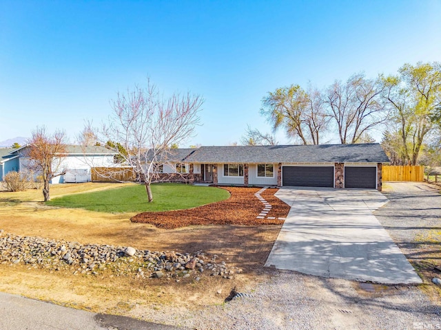 1309 Raeline Ln, Minden, NV 89423 - ranch-style house with a garage and driveway