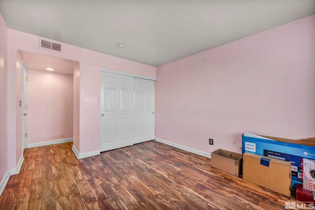 2555 Clear Acre Ln Unit 73, Reno, NV 89512 - unfurnished bedroom with wood finished floors and baseboards