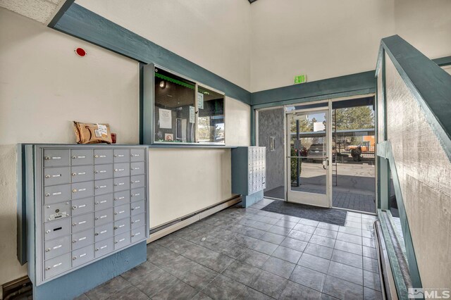 2555 Clear Acre Ln Unit 73, Reno, NV 89512 - interior space with baseboard heating, mail area, and a high ceiling