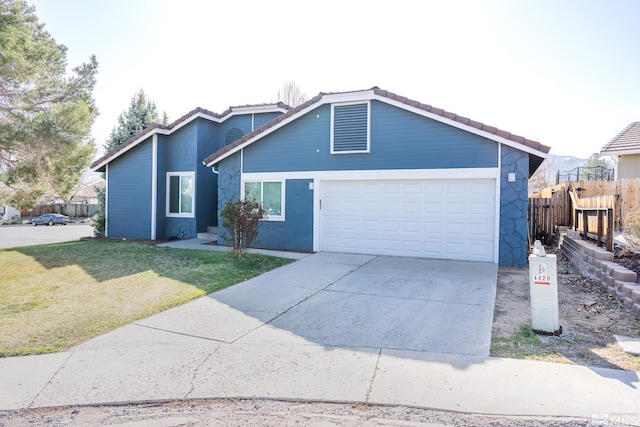 4806 Lincoln Ct, Carson City, NV 89706 - view of front of house featuring stone siding, an attached garage, concrete driveway, and a tiled roof