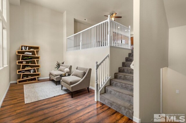 2490 Eastshore Pl, Reno, NV 89509 - stairs featuring wood finished floors, a ceiling fan, a high ceiling, and baseboards