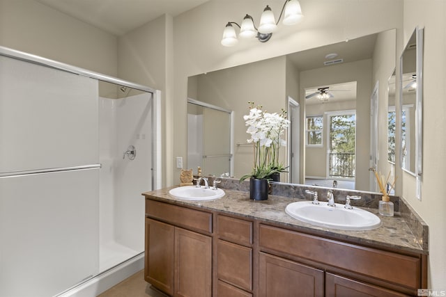 2490 Eastshore Pl, Reno, NV 89509 - bathroom featuring a stall shower, a ceiling fan, and double vanity