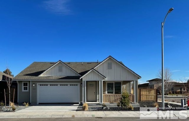 1630 Delta Downs Dr Unit 72, Minden, NV 89423 - view of front of home with board and batten siding, a garage, covered porch, driveway, and fence