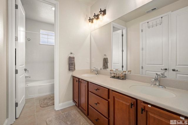 full bath featuring double vanity, tile patterned flooring, tub / shower combination, and baseboards