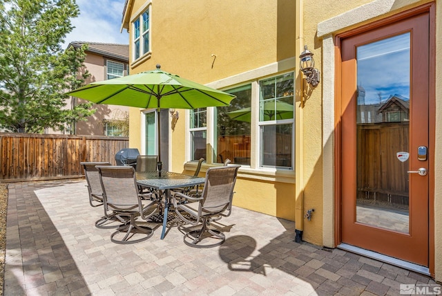 view of patio / terrace with fence and outdoor dining area
