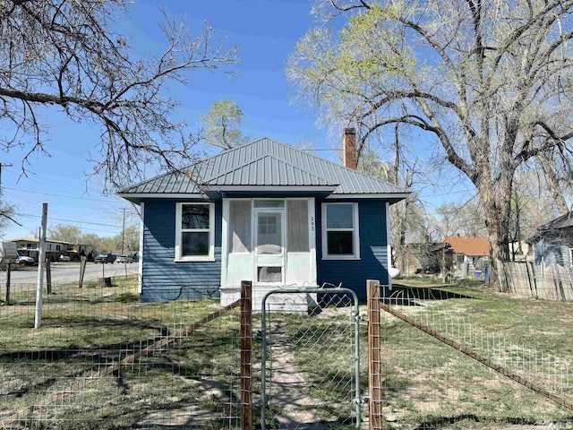 295 Apache St, Imlay, NV 89418 - view of front of home with a gate, metal roof, and a chimney