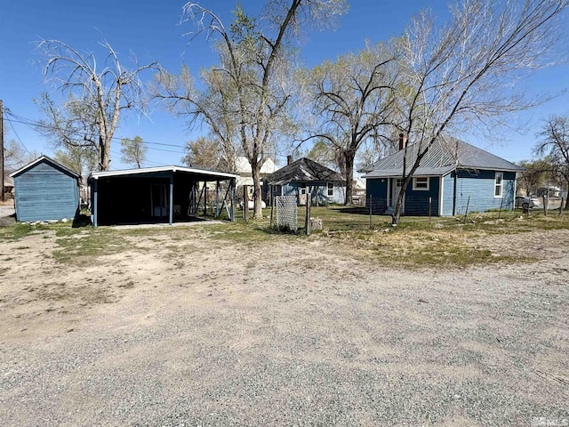295 Apache St, Imlay, NV 89418 - view of yard with a detached carport, an outdoor structure, and driveway
