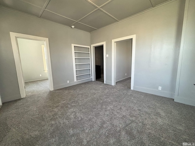 295 Apache St, Imlay, NV 89418 - spare room featuring built in shelves, baseboards, and carpet flooring