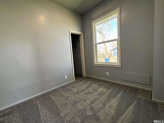 295 Apache St, Imlay, NV 89418 - unfurnished bedroom featuring carpet flooring, baseboards, a walk in closet, and a closet