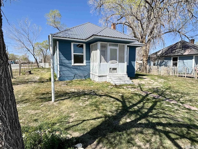 295 Apache St, Imlay, NV 89418 - view of front facade with entry steps, metal roof, and a chimney