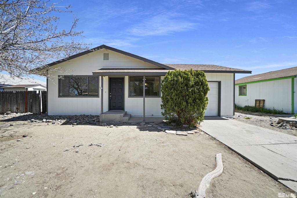 1061 Tiffany Dr, Fallon, NV 89406 - view of front of property with driveway, a garage, and fence