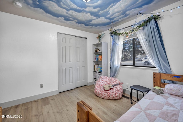 11000 Bighorn Dr, Reno, NV 89508 - bedroom with wood finished floors, baseboards, and a closet