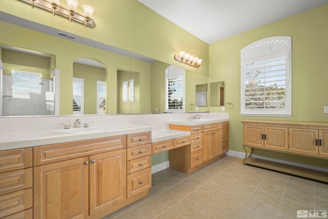 15355 Redmond Loop, Reno, NV 89511 - full bathroom featuring double vanity, tile patterned floors, and a shower