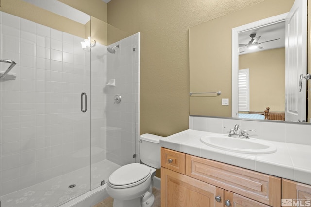 15355 Redmond Loop, Reno, NV 89511 - bathroom with a stall shower, ceiling fan, toilet, and vanity