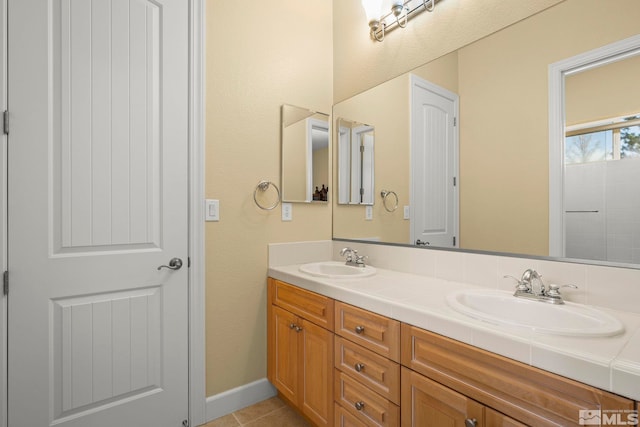 15355 Redmond Loop, Reno, NV 89511 - bathroom featuring double vanity, tile patterned floors, and baseboards
