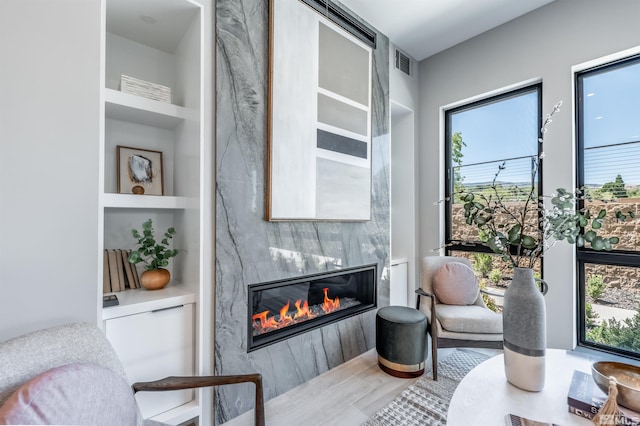 47 Campolina St Unit 23-1, Reno, NV 89511 - living area with built in features, plenty of natural light, and a fireplace