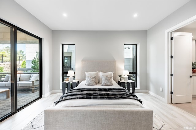 47 Campolina St Unit 23-1, Reno, NV 89511 - bedroom featuring multiple windows, access to exterior, light wood-style floors, and recessed lighting