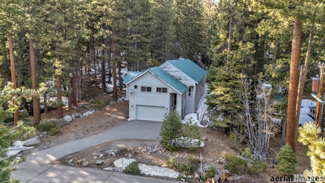 - view of subject property featuring a heavily wooded area