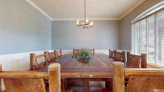 dining area with a chandelier and ornamental molding