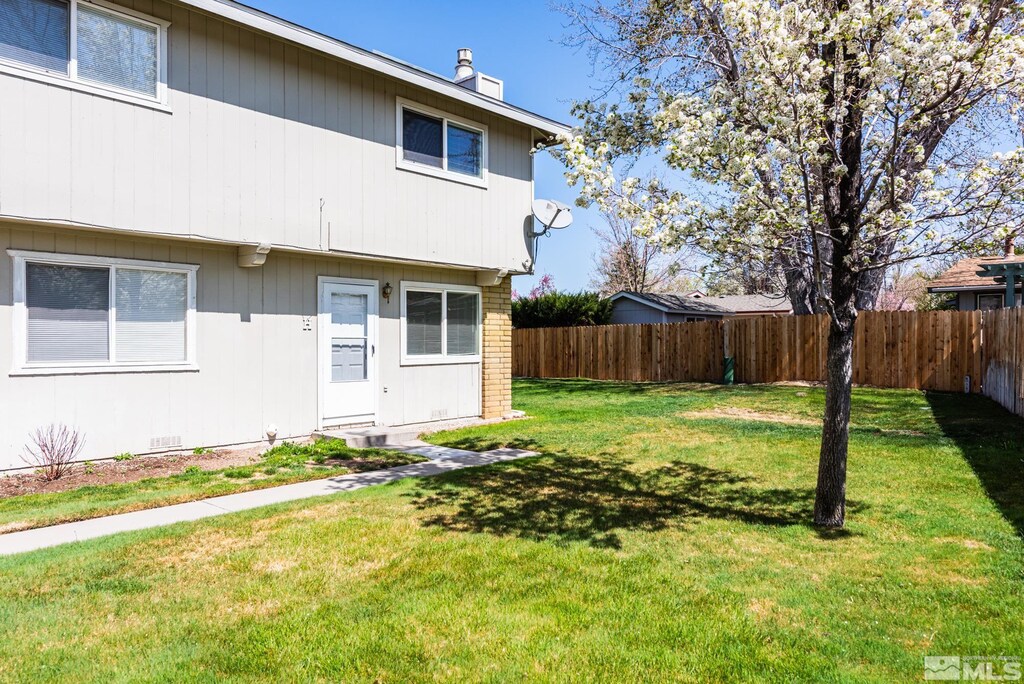 1354 El Dorado Dr Unit H, Gardnerville, NV 89410 - rear view of property featuring brick siding and a chimney