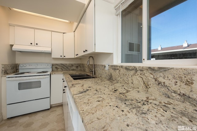 kitchen featuring electric range, under cabinet range hood, a sink, white cabinets, and light stone counters
