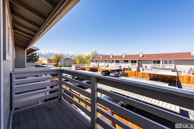 balcony featuring a mountain view and a residential view