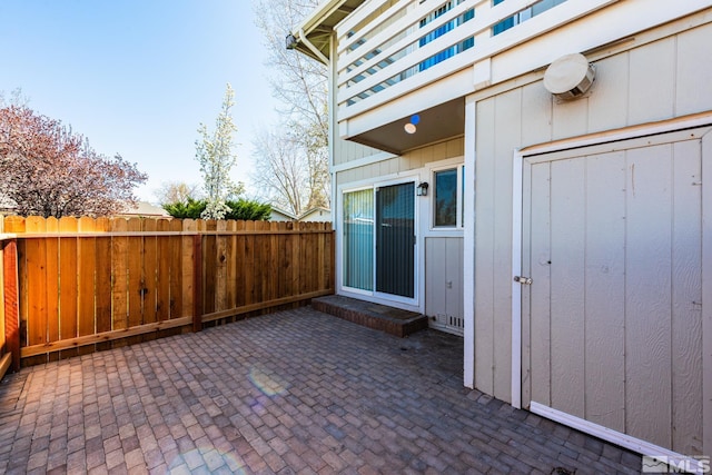 view of patio featuring fence