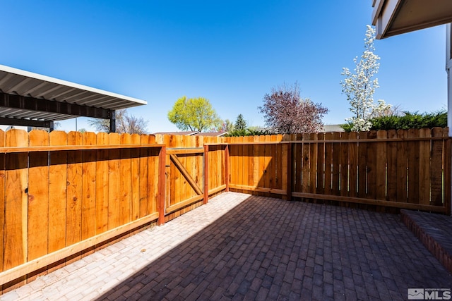 view of patio / terrace featuring fence