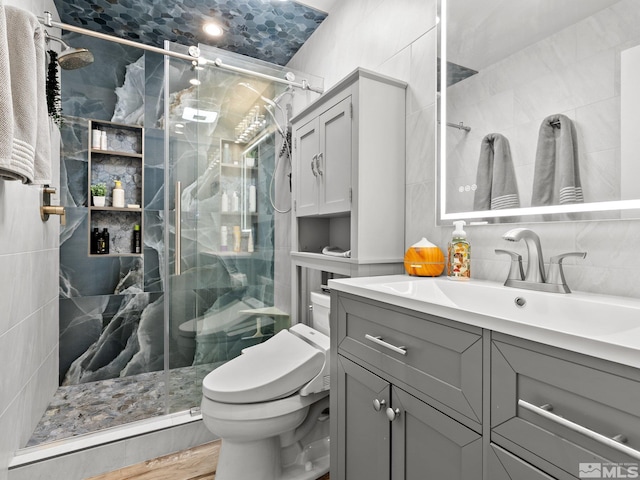 989 Tahoe Blvd Unit 91, Incline Village, NV 89451 - bathroom featuring tile walls, toilet, vanity, a stall shower, and tasteful backsplash