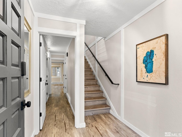 989 Tahoe Blvd Unit 91, Incline Village, NV 89451 - stairs with a textured ceiling, wood finished floors, and baseboards
