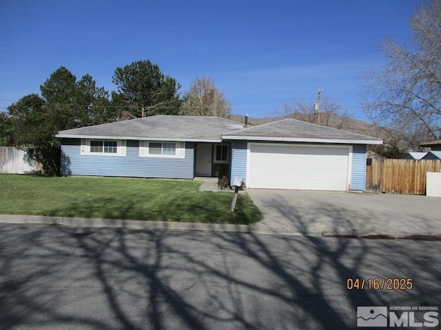 single story home featuring an attached garage and driveway