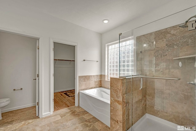 6647 Fabric Dr, Sparks, NV 89436 - bathroom with a shower stall, toilet, a garden tub, and a spacious closet