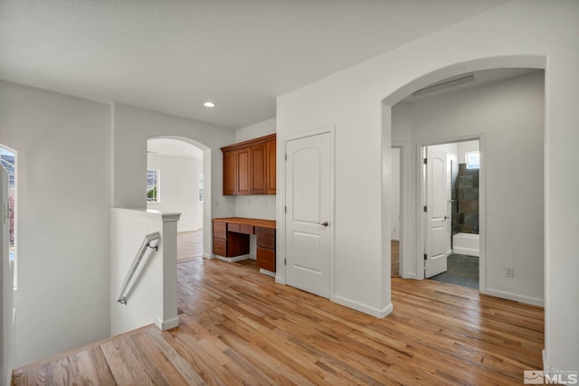 6647 Fabric Dr, Sparks, NV 89436 - corridor featuring light wood-style floors, recessed lighting, baseboards, an upstairs landing, and arched walkways