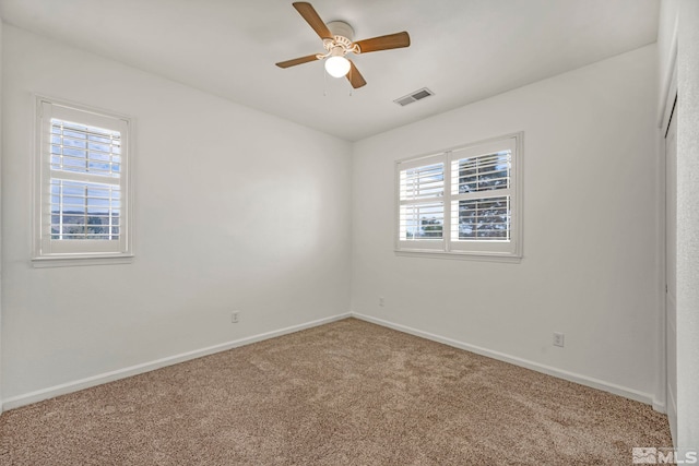 6647 Fabric Dr, Sparks, NV 89436 - unfurnished room featuring healthy amount of natural light, carpet flooring, ceiling fan, and baseboards