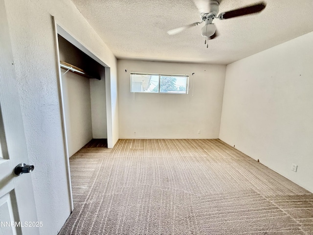 988 Gummow Dr, Fallon, NV 89406 - unfurnished bedroom featuring carpet floors, a textured ceiling, a closet, and ceiling fan