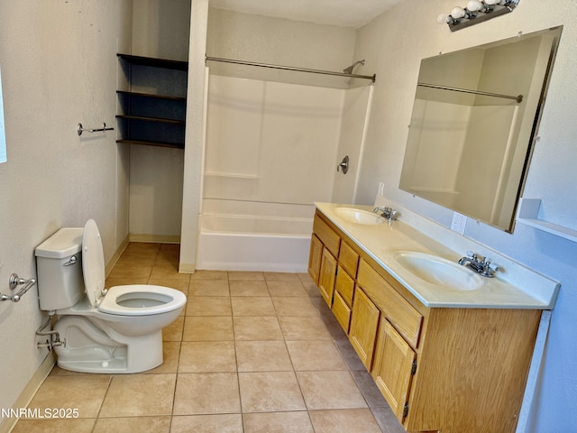 988 Gummow Dr, Fallon, NV 89406 - full bathroom featuring toilet, bathing tub / shower combination, tile patterned floors, double vanity, and baseboards